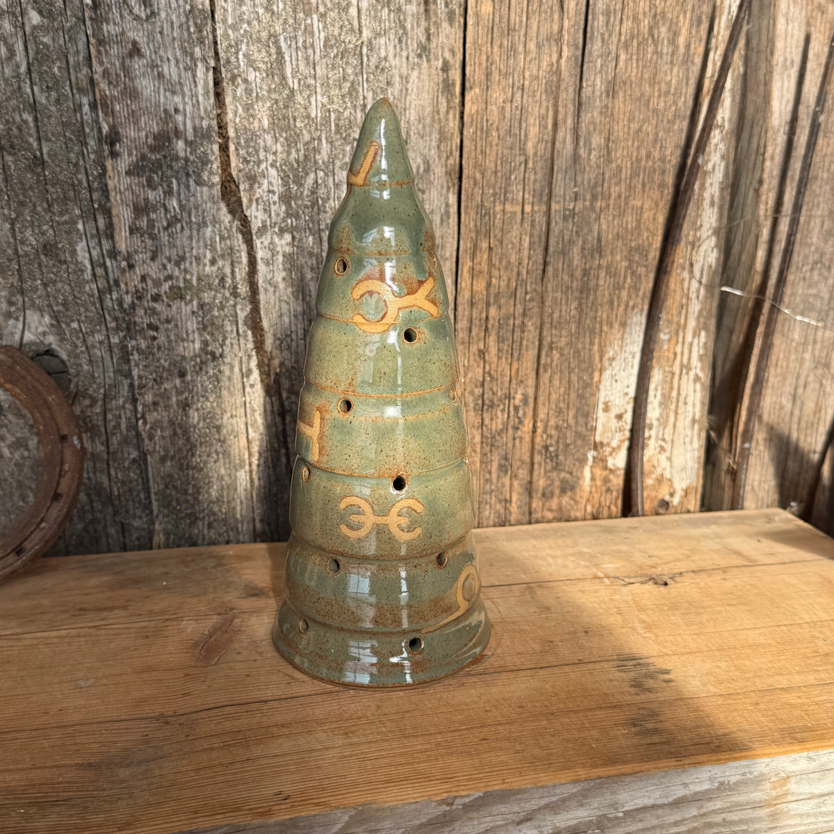 Luminary Christmas tree and cowboy hat tree topper