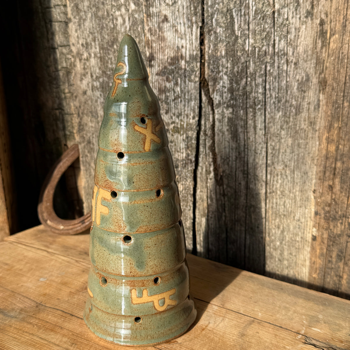 Luminary Christmas tree and cowboy hat tree topper