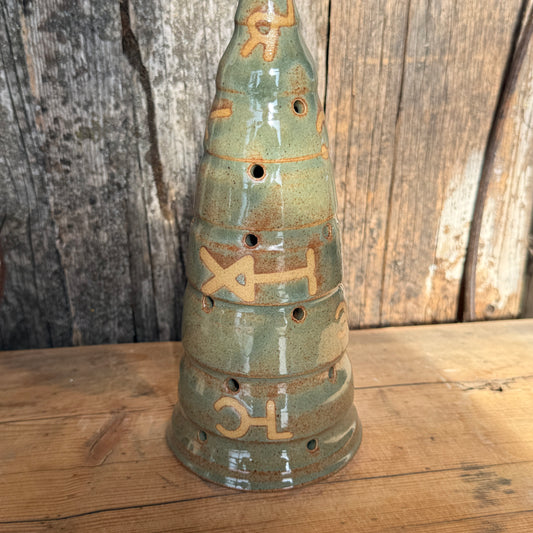 Luminary Christmas tree and cowboy hat tree topper